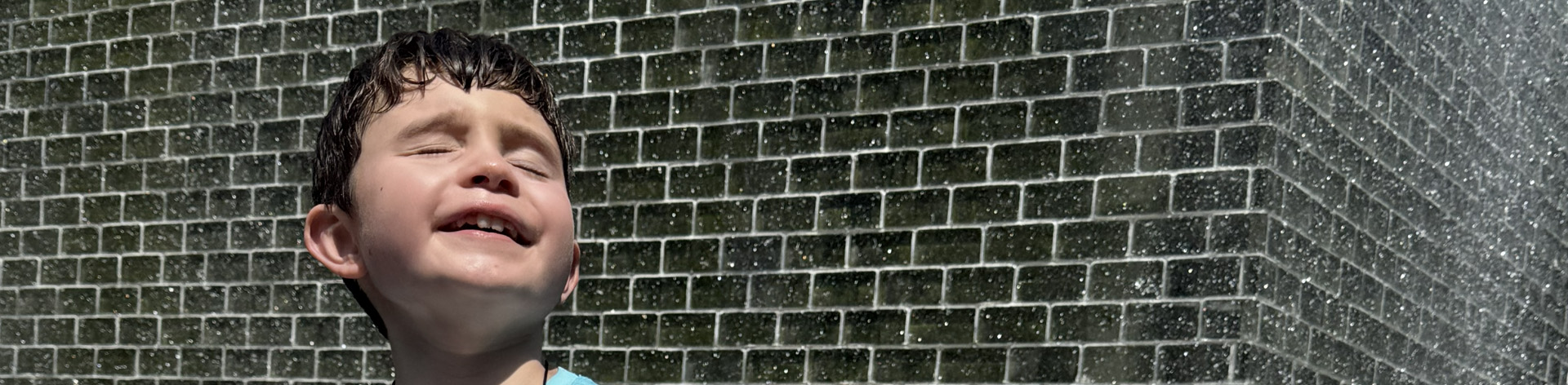 Close up of a young blind boy smiling.